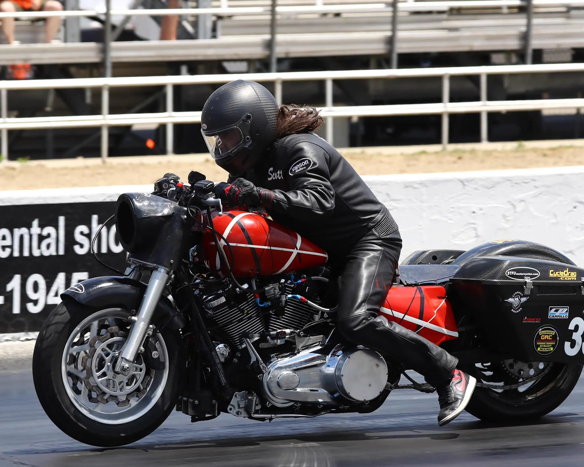 Scott tucked low over Eddie, his red and black turbo Road King, during a pass
