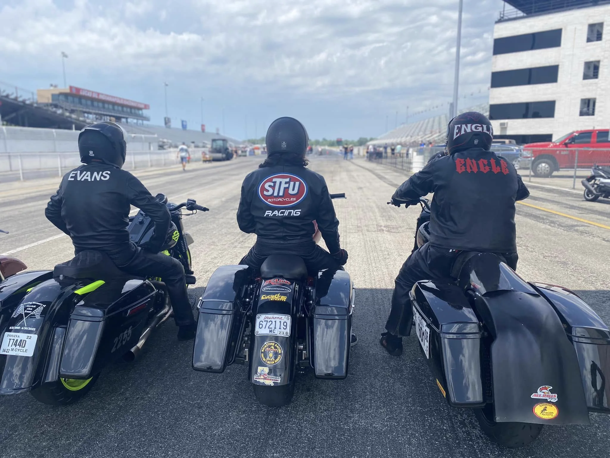 Scott and two other bagger racers waiting side by side in the staging lanes at Indianapolis