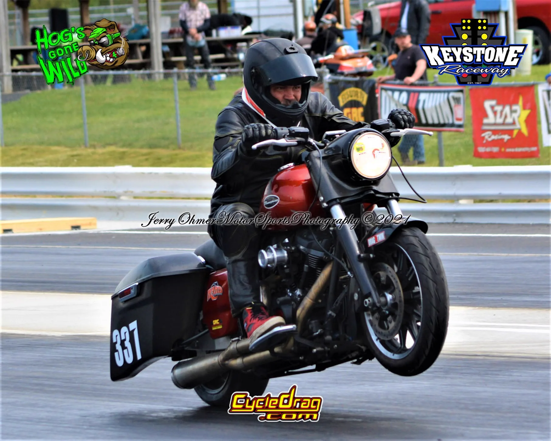 Scott launching the red Dragbag at Keystone Raceway with its front wheel in the air
