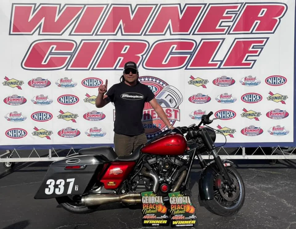 Scott with Dragbob and two winner plaques at Atlanta Dragway